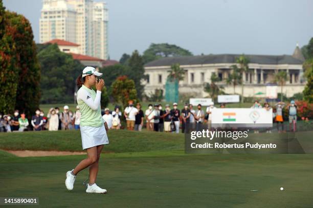 Hinako Shibuno of Japan reacts after a putt on the 2nd green during day three of the Simone Asia Pacific Cup at Pondok Indah Golf Course on August...