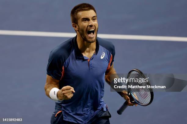 Borna Coric of Croatia celebrates match point against Felix Auger-Aliassime of Canada during the Western & Southern Open at Lindner Family Tennis...