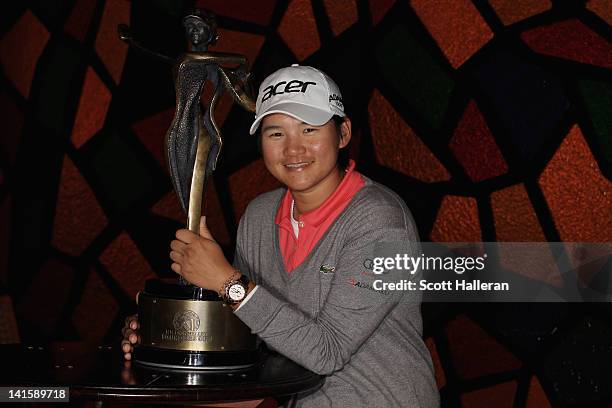 Yani Tseng of Taiwan poses with the trophy after winning the RR Donnelley LPGA Founders Cup at the JW Marriott Desert Ridge Resort & Spa on March 18,...