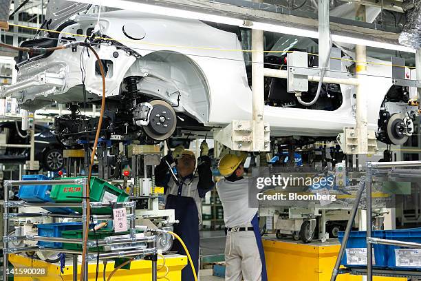 Fuji Heavy Industries Ltd. Employees assemble a Toyota Motor Corp. 86 sports coupe on the Subaru BRZ and Toyota 86 production line at Fuji Heavy's...