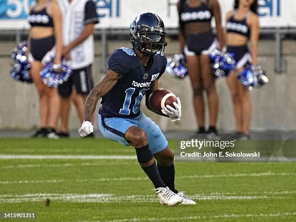 Brandon Banks of the Toronto Argonauts returns a punt against the Hamilton Tiger-Cats at BMO Field on August 6, 2022 in Toronto, Canada.