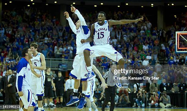 Kansas Jayhawks guard Elijah Johnson and Kansas Jayhawks guard Christian Garrett celebrate at the conclusion of their 63-60 win over the Purdue...