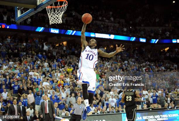 Tyshawn Taylor of the Kansas Jayhawks dunks to put Kansas up 63-61 in the final seconds of the second half against the Purdue Boilermakers during the...