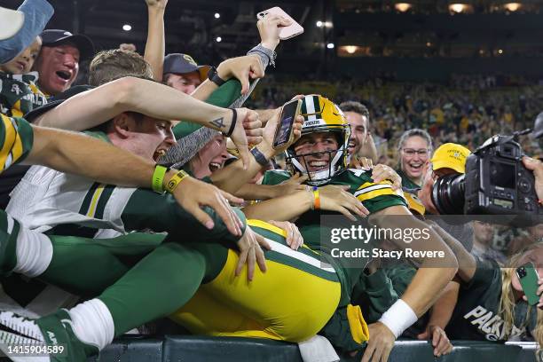 Danny Etling of the Green Bay Packers leaps into the stands following a touchdown against the New Orleans Saints during the second half of a...