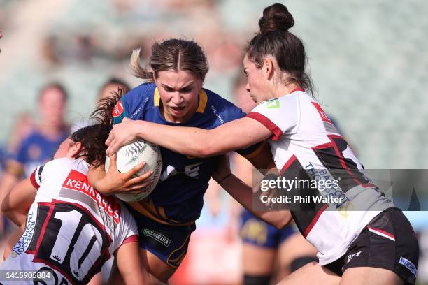 Keely Hill of Otago is tackled during the round six Farah Palmer Cup match between North Harbour and Otago at North Harbour Stadium, on August 20 in...