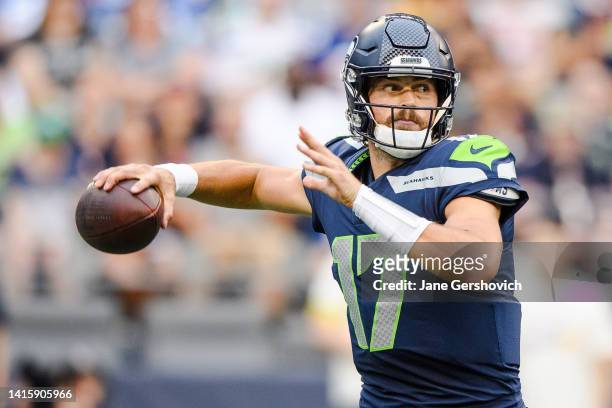 Jacob Eason of the Seattle Seahawks looks for a pass during the second half of the preseason game against the Chicago Bears at Lumen Field on August...