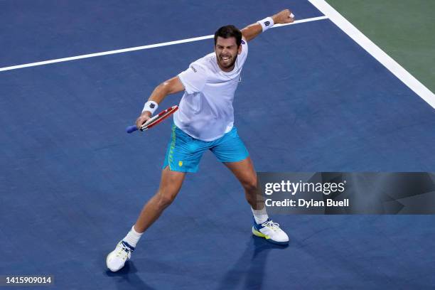 Cameron Norrie of Great Britain celebrates after defeating Carlos Alcaraz of Spain 7-6, 6-7, 6-4 on day seven of the Western & Southern Open at...