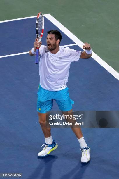 Cameron Norrie of Great Britain celebrates after defeating Carlos Alcaraz of Spain 7-6, 6-7, 6-4 on day seven of the Western & Southern Open at...