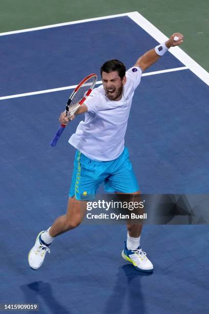 Cameron Norrie of Great Britain celebrates after defeating Carlos Alcaraz of Spain 7-6, 6-7, 6-4 on day seven of the Western & Southern Open at...