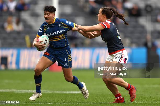 Gayle Broughton of the Eels is tackled by Isabelle Kelly of the Roostersduring the round one NRLW match between the Parramatta Eels and the Sydney...