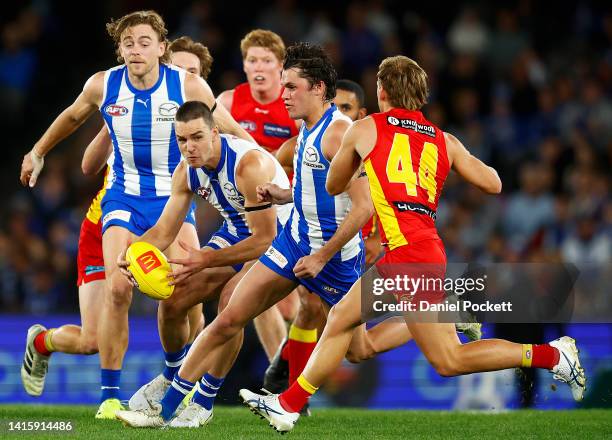 Luke Davies-Uniacke of the Kangaroos runs with the ball during the round 23 AFL match between the North Melbourne Kangaroos and the Gold Coast Suns...