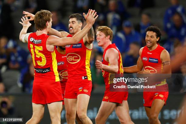 Alex Sexton of the Suns celebrates kicking a goal during the round 23 AFL match between the North Melbourne Kangaroos and the Gold Coast Suns at...