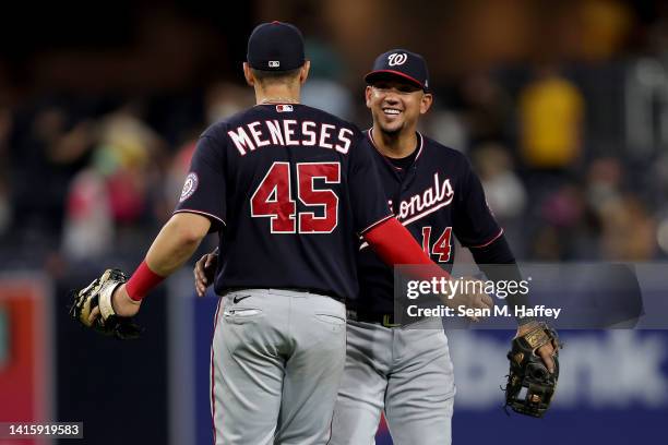 Joey Meneses and Ildemaro Vargas of the Washington Nationals of the Washington Nationals celebrate after defeting the San Diego Padres 6-3 in a game...