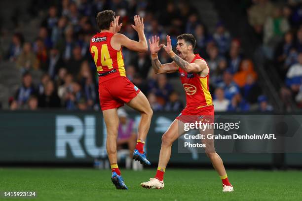 Alex Sexton of the Suns celebrates kicking a goal during the round 23 AFL match between the North Melbourne Kangaroos and the Gold Coast Suns at...