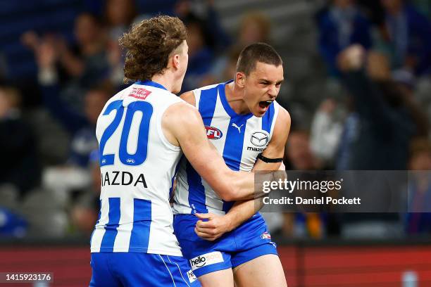 Luke Davies-Uniacke of the Kangaroos celebrates kicking a goal during the round 23 AFL match between the North Melbourne Kangaroos and the Gold Coast...