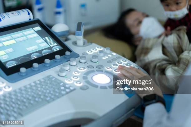 doctor used an ultrasound sonogram  monitor for  the fetus 12 weeks young adult patient pregnant - 20 week foetus stock pictures, royalty-free photos & images