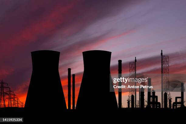 nuclear power plant at sunset - nuclear power station stock pictures, royalty-free photos & images