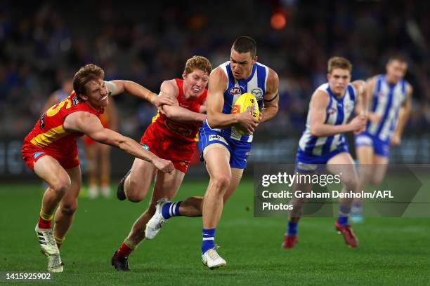 Luke Davies-Uniacke of the Kangaroos runs with the ball during the round 23 AFL match between the North Melbourne Kangaroos and the Gold Coast Suns...