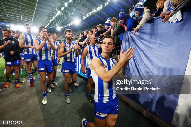 The Kangaroos are cheered off the ground after defeat during the round 23 AFL match between the North Melbourne Kangaroos and the Gold Coast Suns at...
