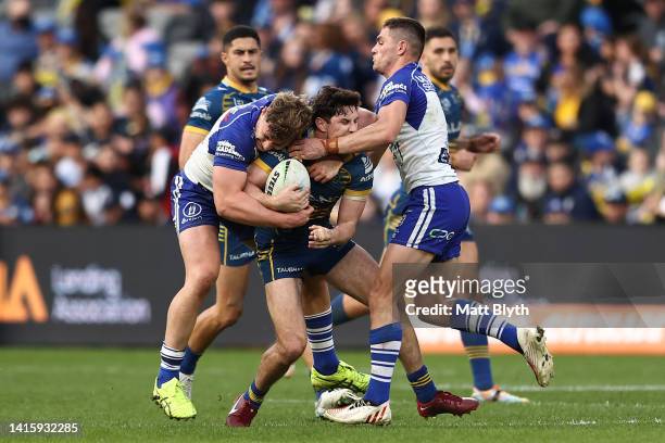 Mitchell Moses of the Eels is tackled during the round 23 NRL match between the Parramatta Eels and the Canterbury Bulldogs at CommBank Stadium on...