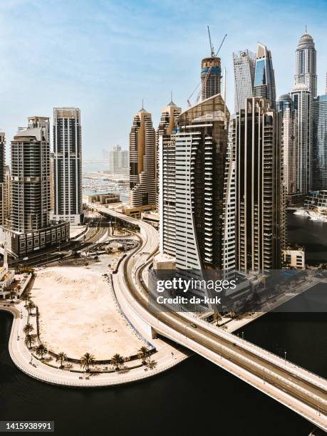 modern skyscrapers of dubai in united arab emirates - dubai water canal stock pictures, royalty-free photos & images