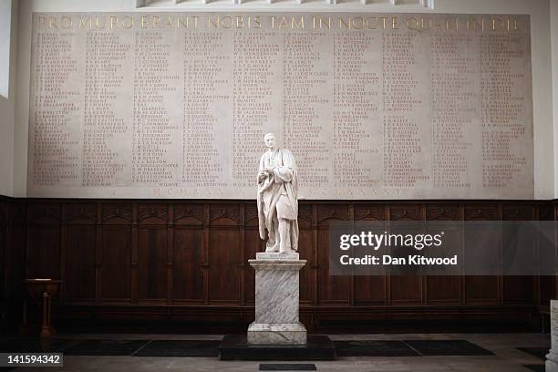 Statue of Isaac Newton stands in Trinity College on March 13, 2012 in Cambridge, England. Cambridge has a student population in excess of 22,000...