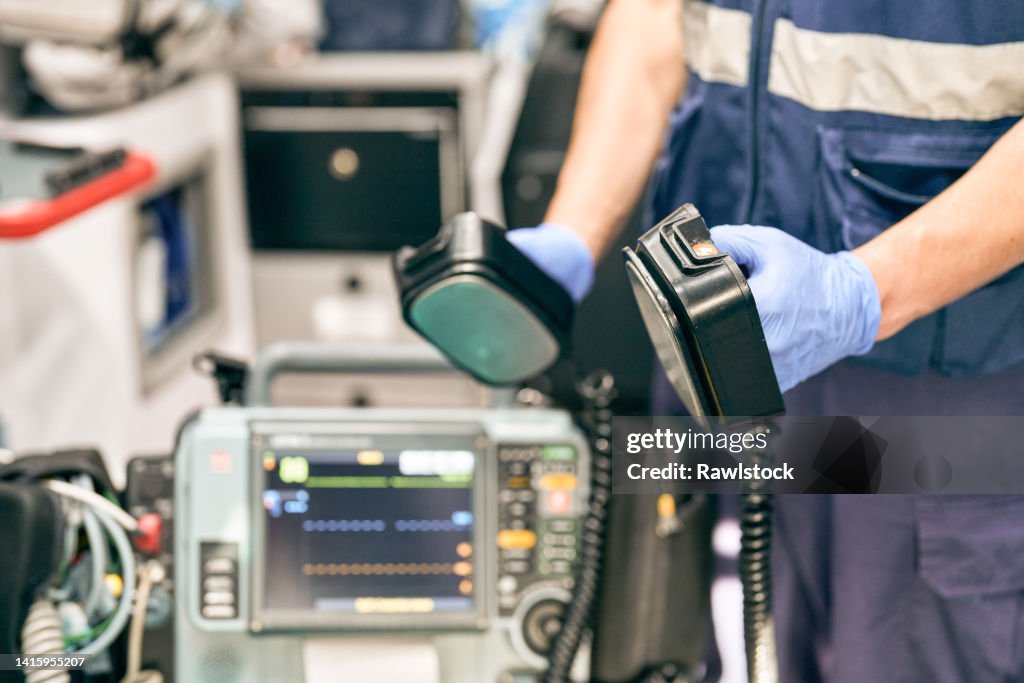 Paramedic Using A Defibrillator High-Res Stock Photo - Getty Images