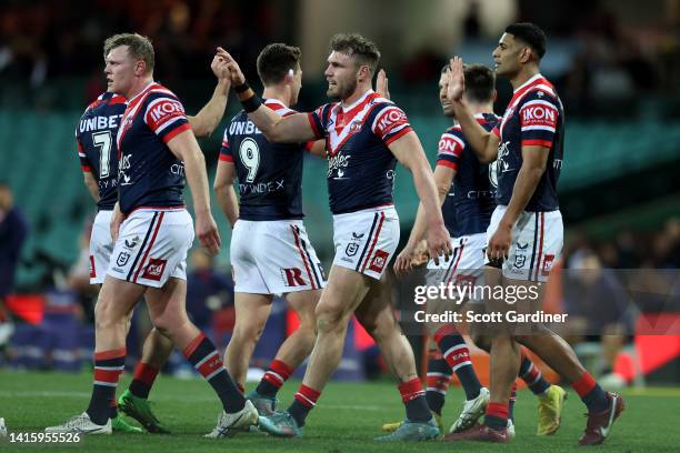 Angus Crichton of the Roosters celebrates a try with teammates during the round 23 NRL match between the Sydney Roosters and the Wests Tigers at...