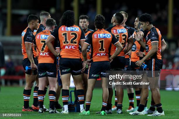 West Tigers players following a roosters try during the round 23 NRL match between the Sydney Roosters and the Wests Tigers at Sydney Cricket Ground,...