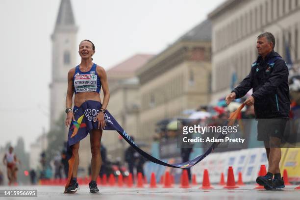 Gold medalist Antigoni Ntrismpioti of Greece celebrates while crossing the finish line during the Women's 20km Race Walk Final on day 10 of the...