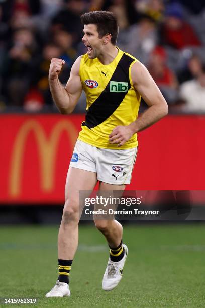 Trent Cotchin of the Tigers celebrates a goal during the round 23 AFL match between the Essendon Bombers and the Richmond Tigers at Melbourne Cricket...