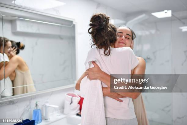 girlfriends embracing each other lovingly in bathroom - couple and kiss and bathroom 個照片及圖片檔