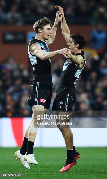 Todd Marshall of Port Adelaide celebrates a goal with Connor Rozee of Port Adelaide during the round 23 AFL match between the Port Adelaide Power and...