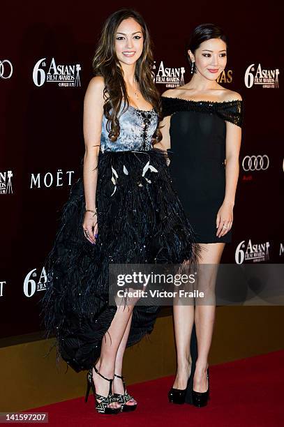 Hong Kong model and actress Jessica Cambensy and Chinese actress Deng Jia Jia pose at the red carpet during the 6th Asian Film Awards, celebrating...