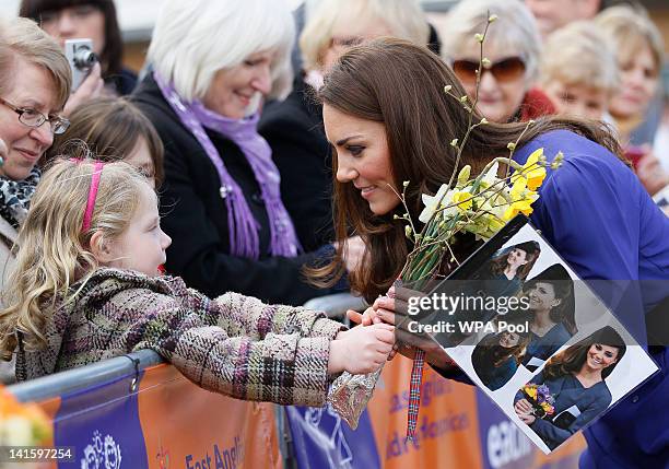 Catherine, Duchess of Cambridge meets a young fan during a visit to open The Treehouse Children's Hospice on March 19, 2012 in Ipswich, England.