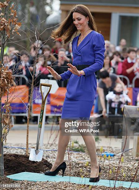 Catherine, Duchess of Cambridge during a tree planting ceremony whilst on a visit to open The Treehouse Children's Hospice on March 19, 2012 in...