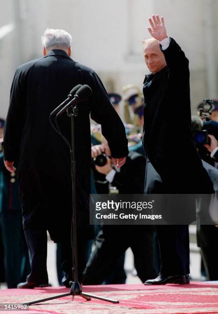 Russian President Vladimir Putin, right, waves, May 7, 2000 in the Kremlin in Moscow after being sworn in as Russia''s second democratically elected...