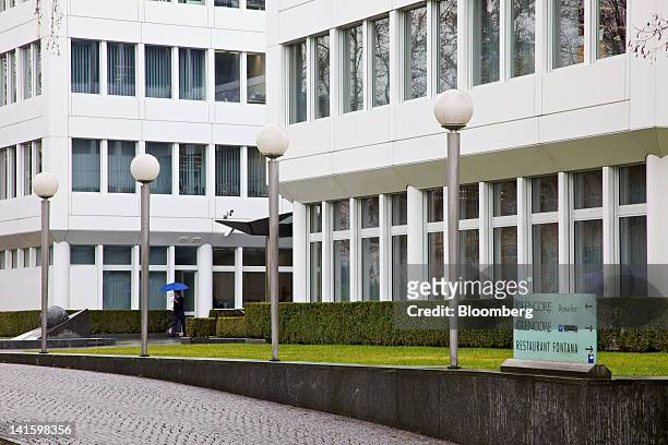 Pedestrian passes the headquarters of Glencore International Plc in Baar, Switzerland, on Monday, March 19, 2012. Glencore International Plc Chief...