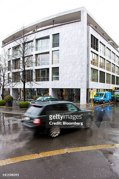 Traffic passes the building that houses the headquarters of Xstrata Plc in Zug, Switzerland, on Monday, March 19, 2012. Glencore International Plc...