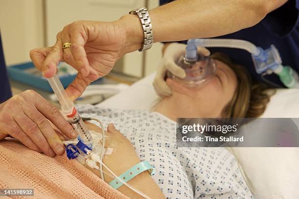 An anonymous woman having a general anaesthetic before weight loss surgery. She is having a gastric band fitted at a private hospital, Spire...