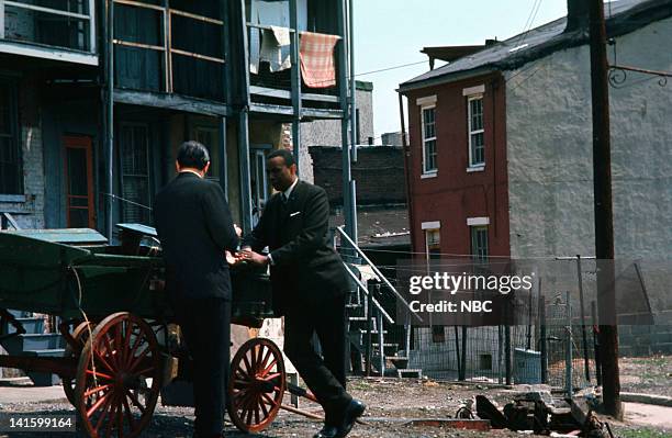 Pictured: NBC News' Sander Vanocur, Floyd McKissick leader of CORE, the Congress of Racial Equality, in a black ghetto in Baltimore, Maryland during...