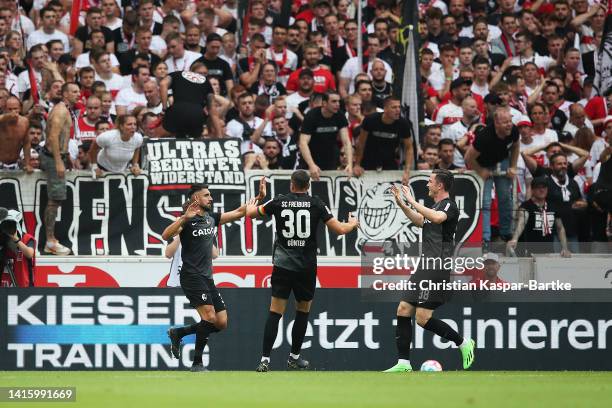 Vincenzo Grifo of SC Freiburg celebrates their sides first goal with team mate Christian Gunter oduring the Bundesliga match between VfB Stuttgart...