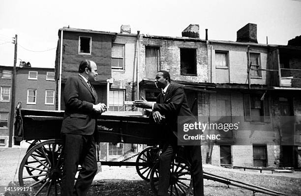 Pictured: NBC News' Sander Vanocur, Floyd McKissick leader of CORE, the Congress of Racial Equality, in a black ghetto in Baltimore, Maryland during...