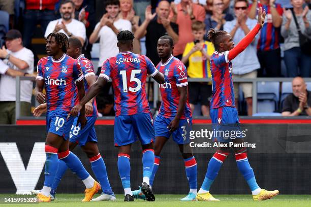 Wilfried Zaha of Crystal Palace celebrates their sides first goal during the Premier League match between Crystal Palace and Aston Villa at Selhurst...