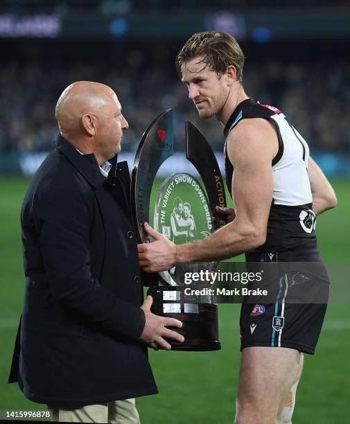 Tom Jonas of Port Adelaide is presented the Showdown Shield after the round 23 AFL match between the Port Adelaide Power and the Adelaide Crows at...