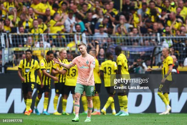 Mitchell Weiser of SV Werder Bremen reacts after Julian Brandt of Borussia Dortmund scores their team's first goal during the Bundesliga match...