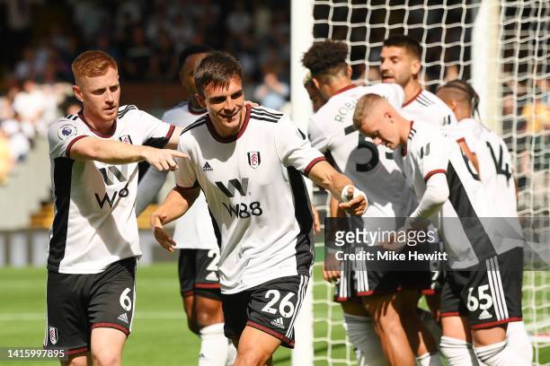 Joao Palhinha of Fulham celebrates with teammates after scoring their team's second goal during the Premier League match between Fulham FC and...