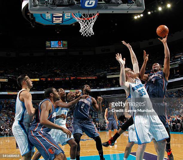 Derrick Brown of the Charlotte Bobcats takes a shot against Chris Kaman of the New Orleans Hornets on March 12, 2012 at the New Orleans Arena in New...