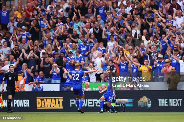 James Maddison of Leicester City celebrates with teammate Kiernan Dewsbury-Hall after scoring their team's first goal during the Premier League match...