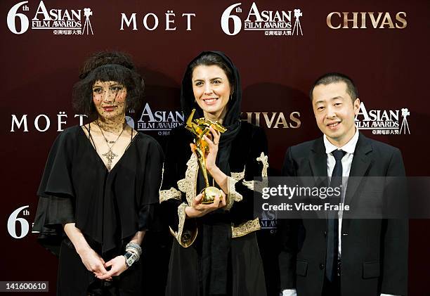 Iranian actress Leila Hatami receives the Best Director award on behalf of Iranian filmmaker Asghar Farhadi for the film 'A Separation' during the...